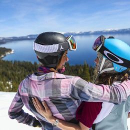 Girls spring skiing at Homewood Resort with a big Lake Tahoe view