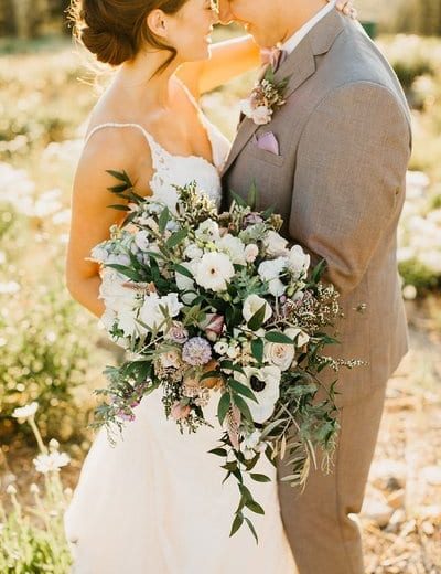 Bride and groom with large boquet in Tahoe