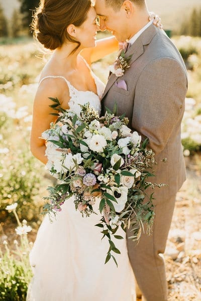 Bride and groom with large boquet in Tahoe