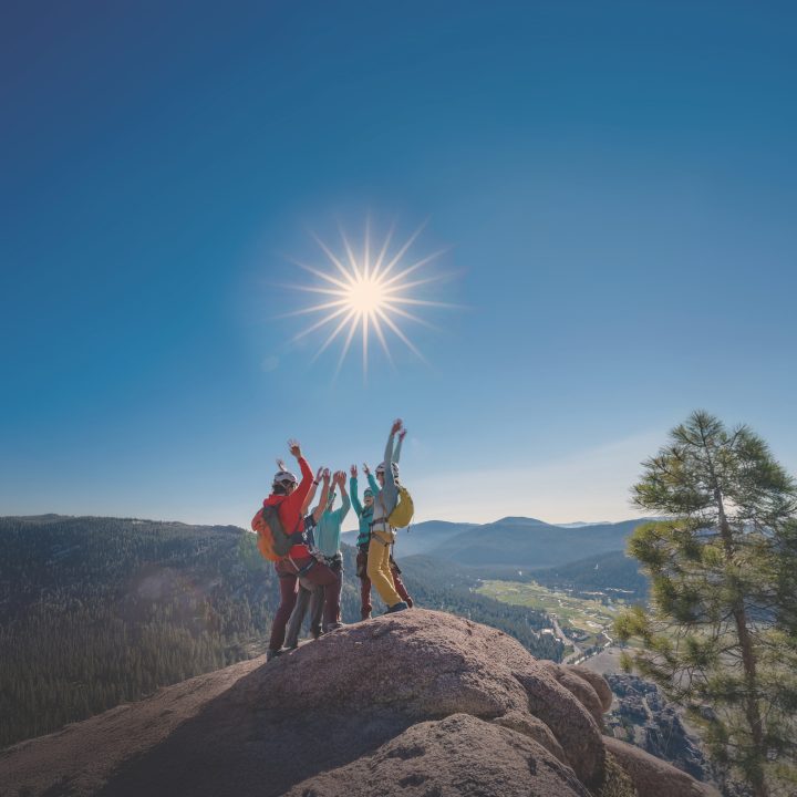 Group on a hike high-fiving